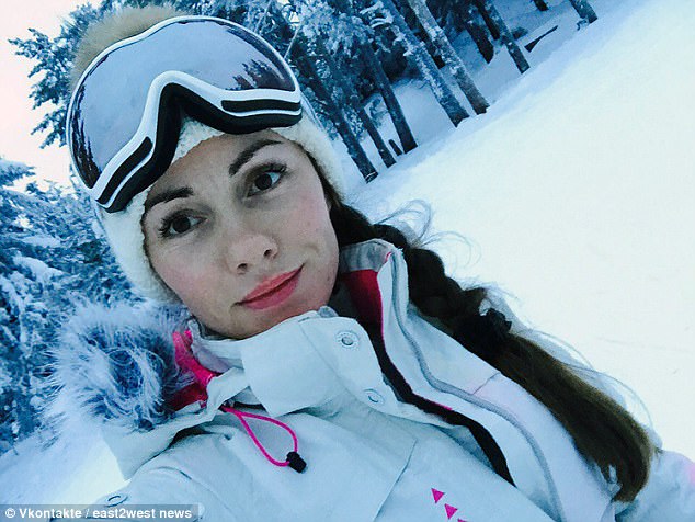 Natalia Borodina (pictured on a skiing holiday), 35, was filmed hanging topless out of a window during a holiday in the Dominican Republic