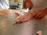 Fat is trimmed from pork stomach